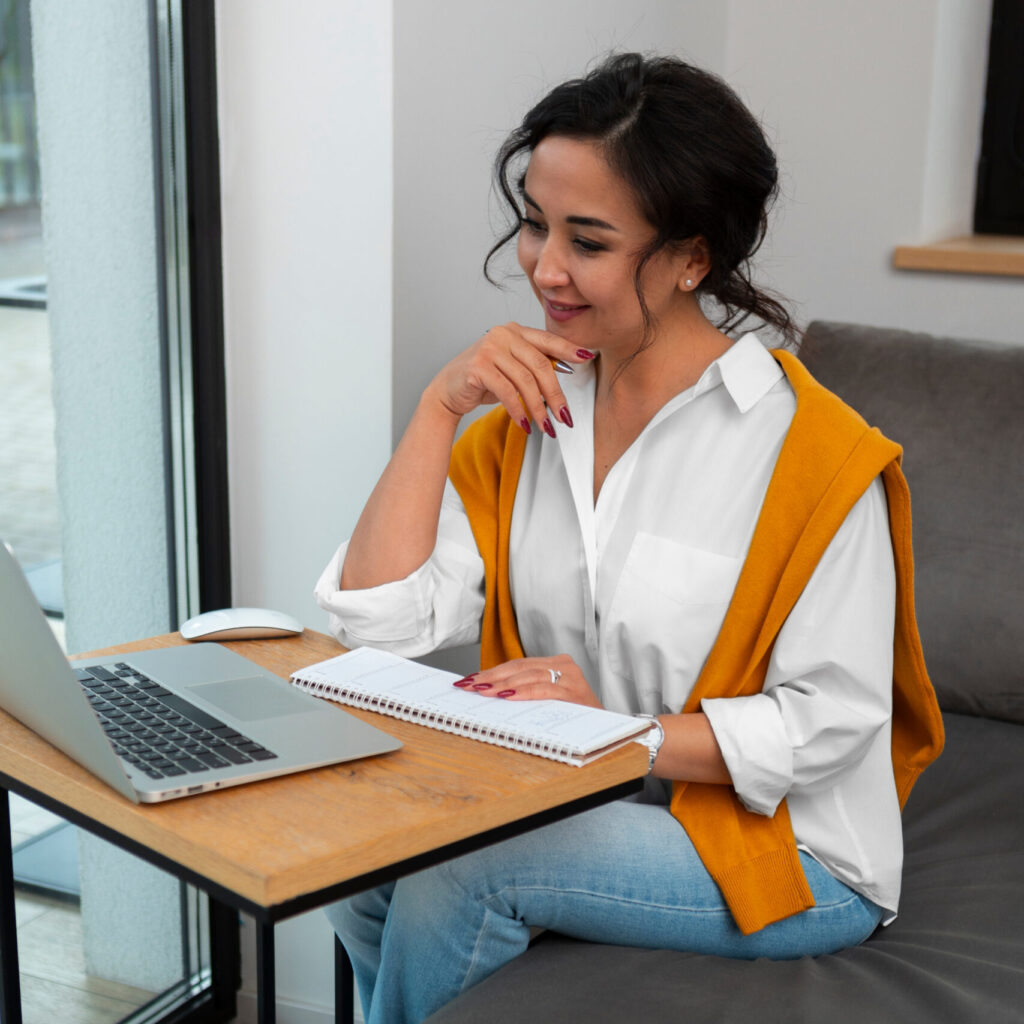 Woman at a desk with laptop